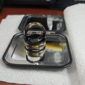 Gold and Black Jewelry Accessory with Elegant Design